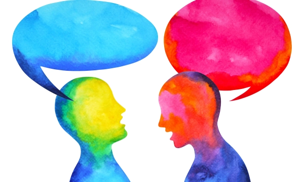 Two abstract figures in vibrant colors engaged in conversation, with speech bubbles above them in blue and pink, representing dialogue and communication.