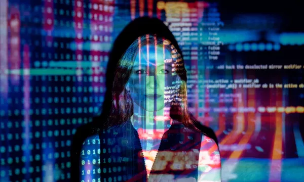 A woman’s face is overlaid with colorful digital graphics, including binary code and abstract data patterns, creating a blend of technology and human emotion.