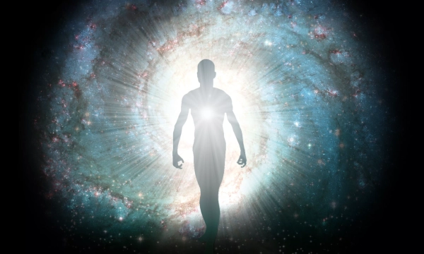 A silhouette of a human figure walking towards a bright light against a backdrop of swirling galaxies and stars, representing a cosmic or spiritual journey.