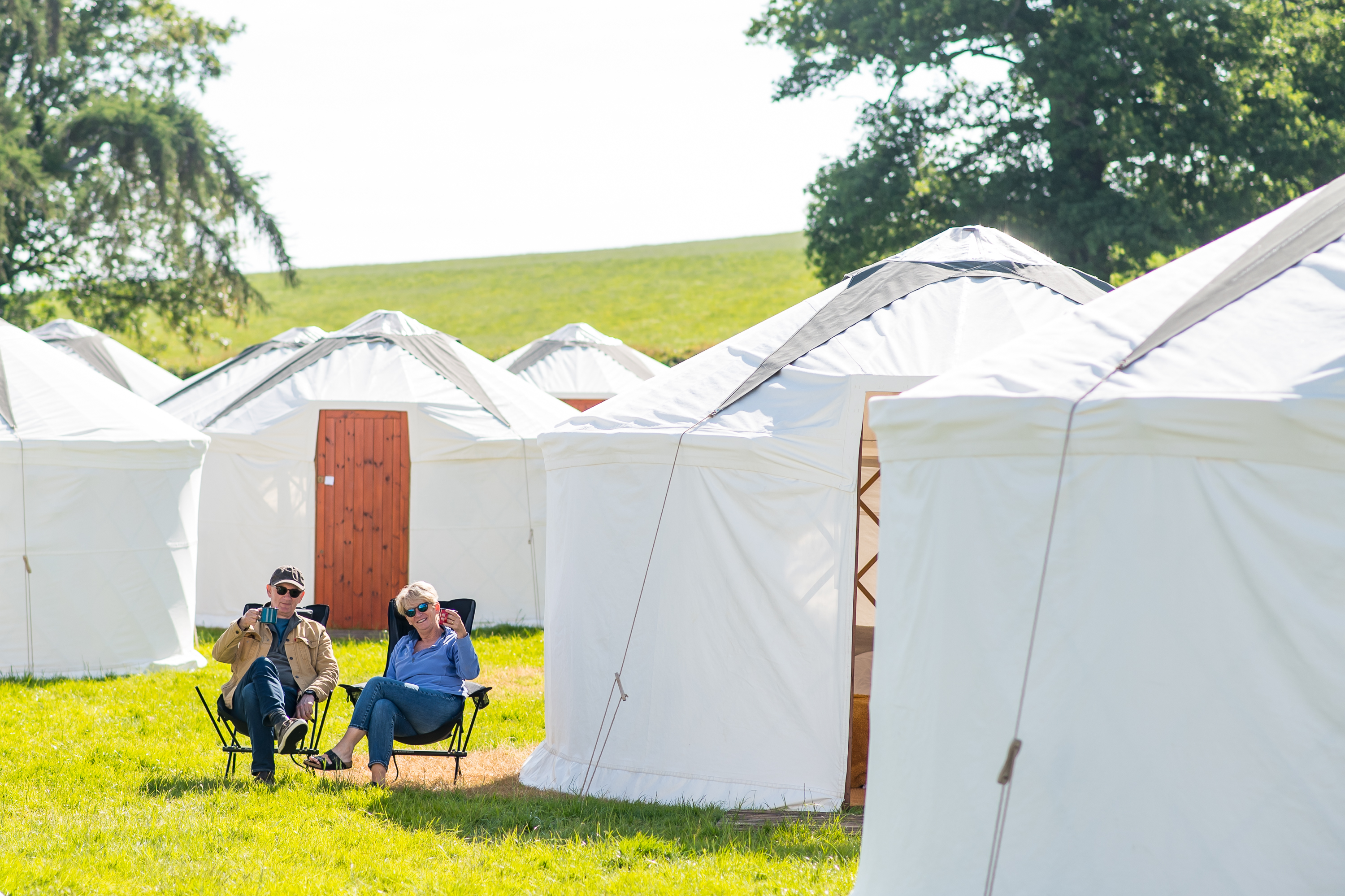 people outsiside yurt